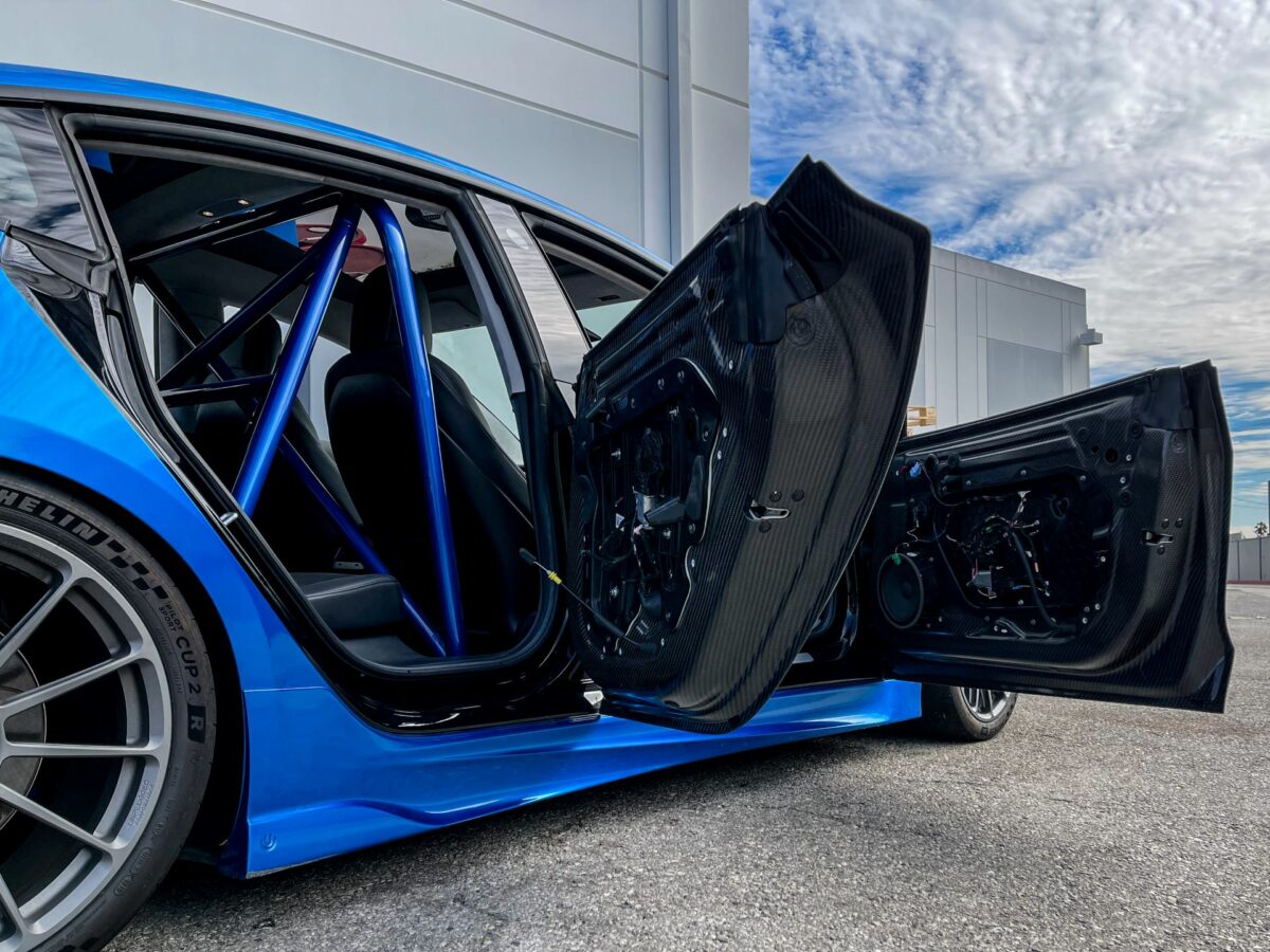 UNPLUGGED PERFORMANCE UP-M3-352-1.1 Rear Door Pair, Dry Carbon, Raw for TESLA Model 3 Photo-0 